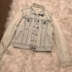 Light wash distressed denim jacket
